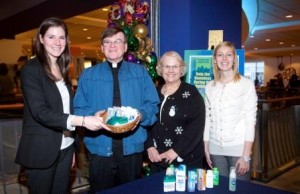 Pictured left to right are: Mary Fallon, Media Director at Garvey Communication Associates Inc.; Father Jim Brennan, Co-Director of St. Francis Chapel; Ellen Lambert, volunteer; and Amanda Gauthier, Social Media Assistant at Garvey Communication Associates Inc.