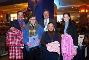 L-R: Anthony Cignoli, president of A.L. Cignoli; Fr. Brennan, co-director at St. Francis Chapel; Don Anderson, owner of the Cruise Store; Aida Claudio, volunteer at St. Francis Chapel; and Mary Fallon, media director at Garvey Communication Associates Inc.